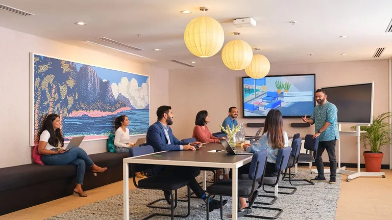 Team gathered in a WeWork lounge